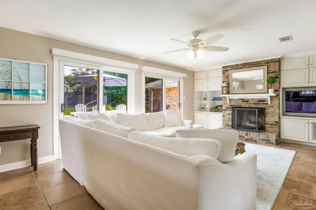 a living room with fireplace furniture and a fireplace