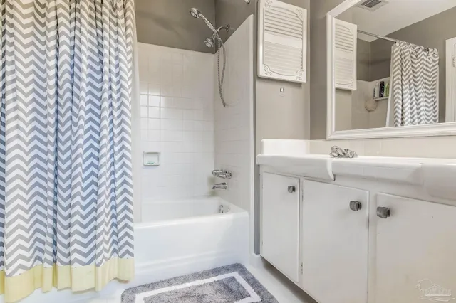 a bathroom with a bathtub and shower