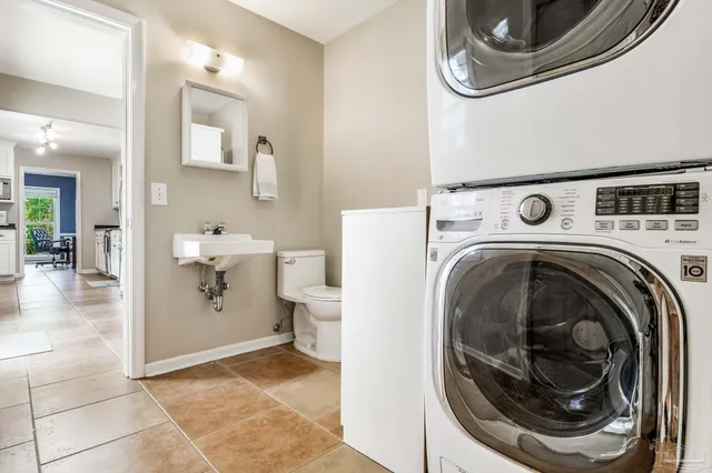 a view of a storage and utility room with washer and dryer