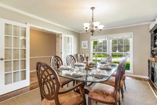a view of a dining room with furniture window and outside view