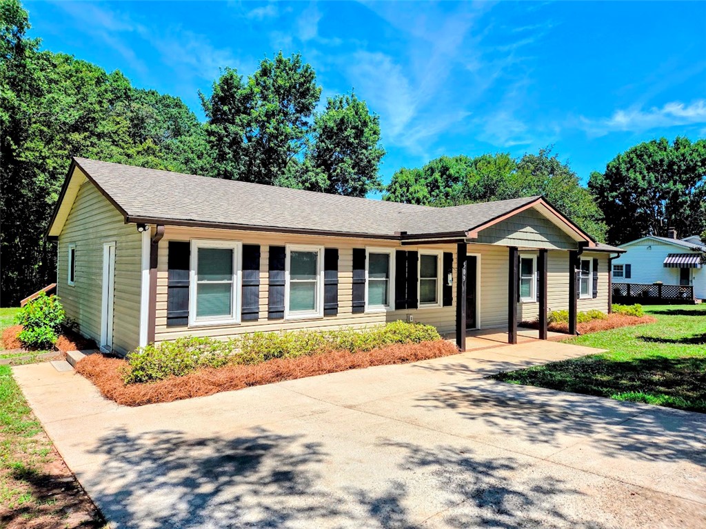 509 Elrod Road Piedmont, SC 29673 - Photo 1 of 28 A well-maintained single-story home with a paved driveway and mature landscaping, offering inviting curb appeal.