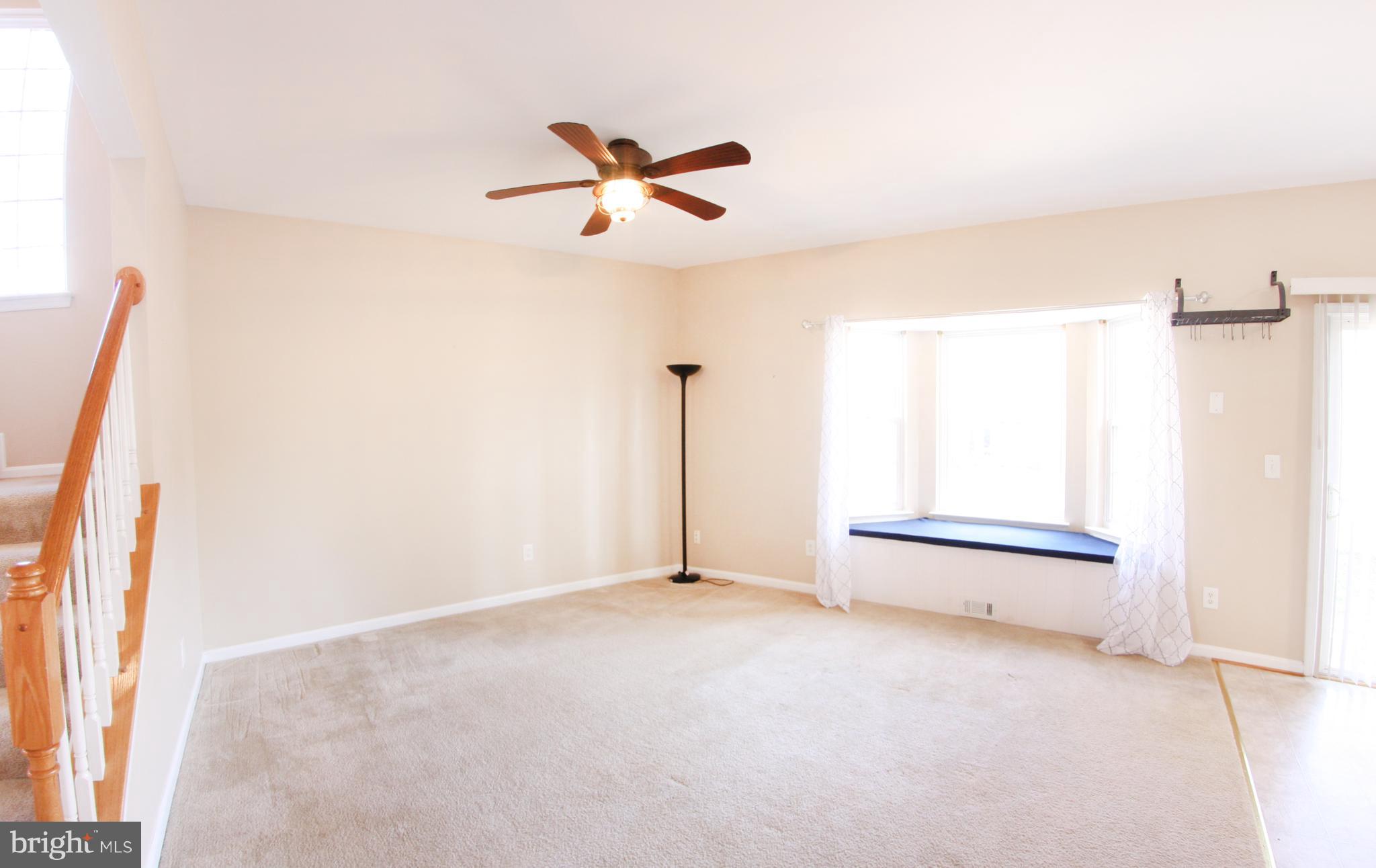133 Myrtle Avenue Severn, MD 21144 - Photo 7 of 34 Large dining room with window seat and ceiling fan