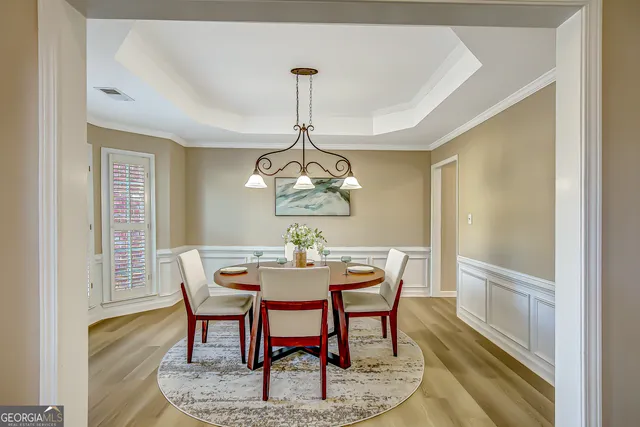 a view of an entryway with wooden floor and a door