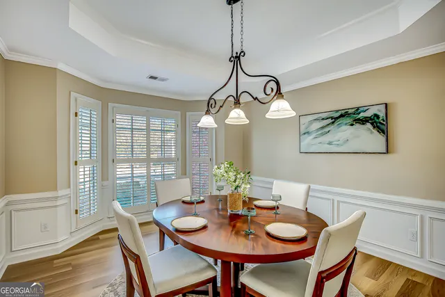 a bedroom with a bed and ceiling fan