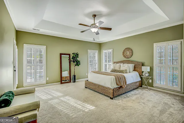 a spacious bathroom with a double vanity sink a mirror a bathtub and shower