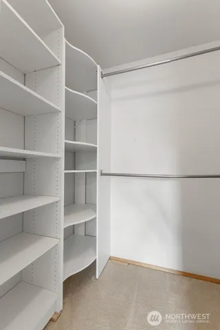 a view of an empty walk in closet