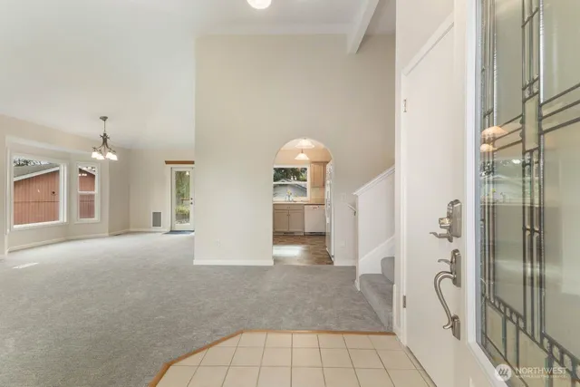 a view of a big room with closet and windows