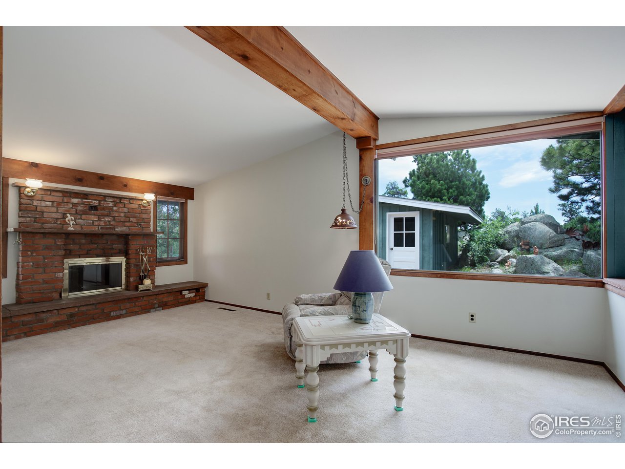 107 Deer Trail Road Boulder, CO 80302 - Photo 12 of 40 a living room with furniture and a fireplace