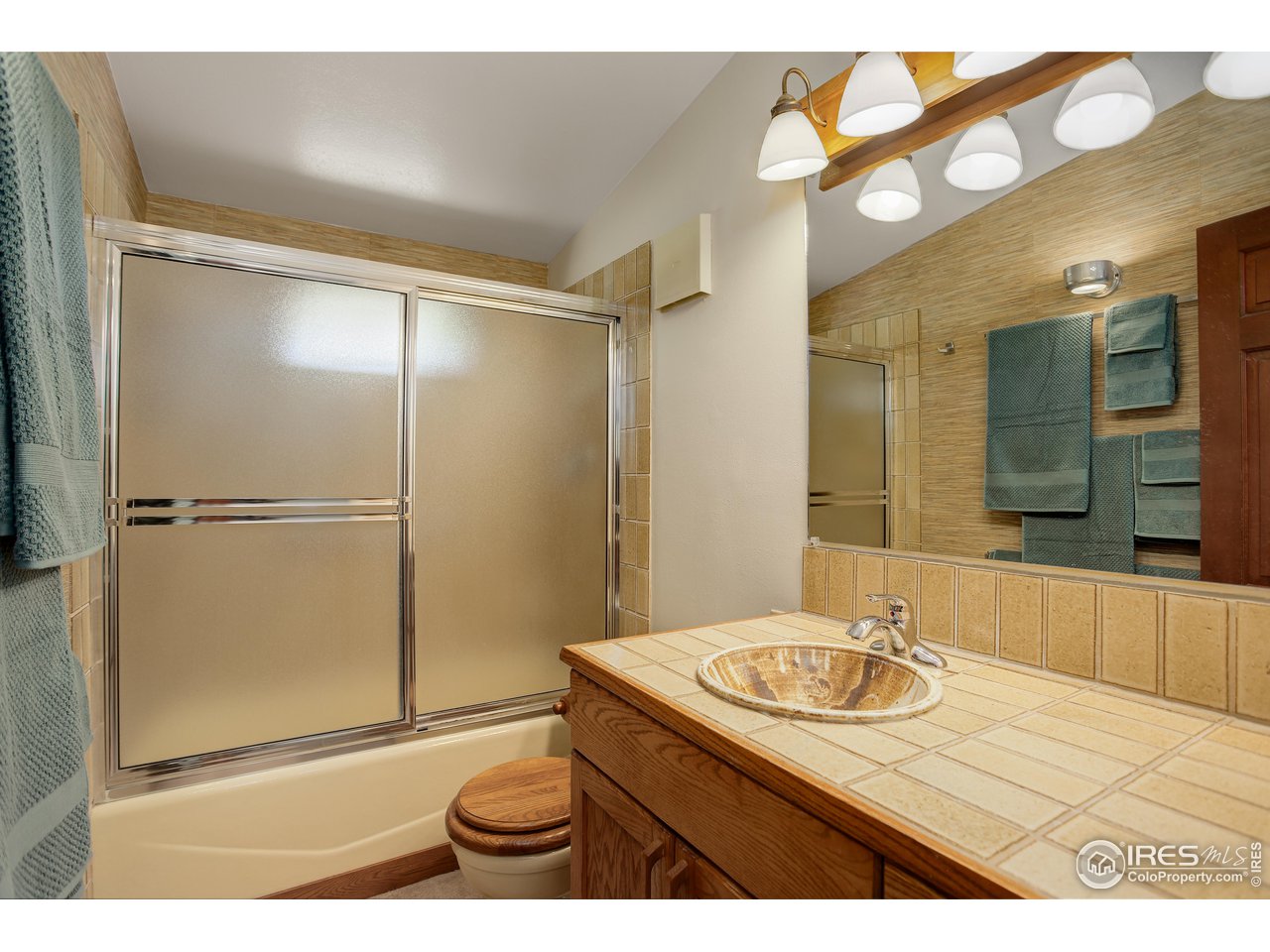 107 Deer Trail Road Boulder, CO 80302 - Photo 22 of 40 a bathroom with a sink and a mirror