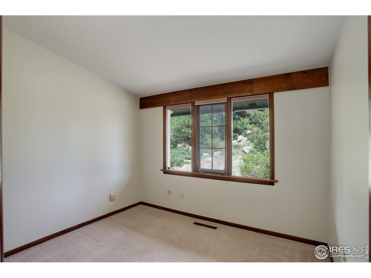 107 Deer Trail Road Boulder, CO 80302 - Photo 23 of 40 a view of an empty room with a window