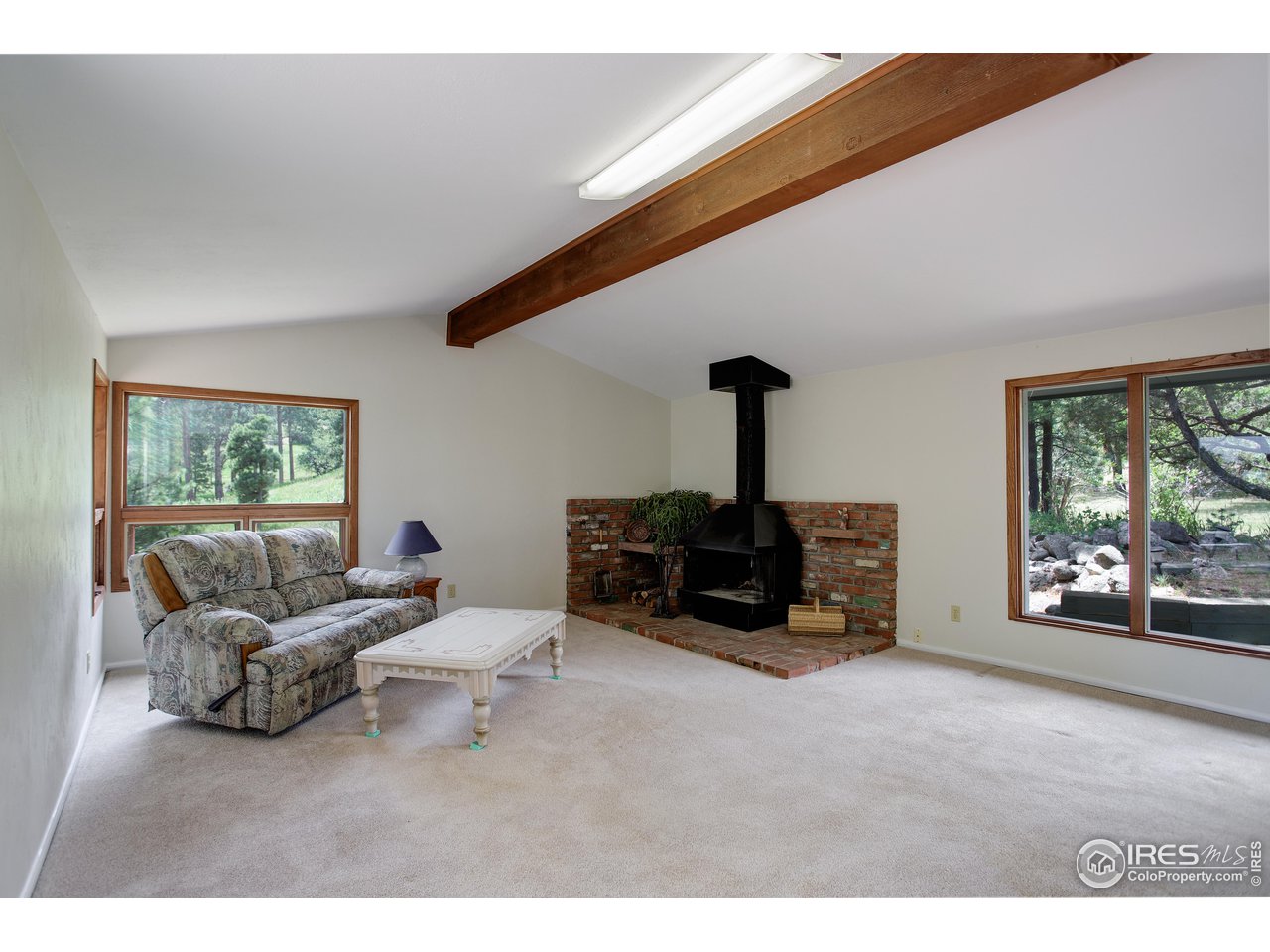 107 Deer Trail Road Boulder, CO 80302 - Photo 28 of 40 a living room with furniture and a floor to ceiling window