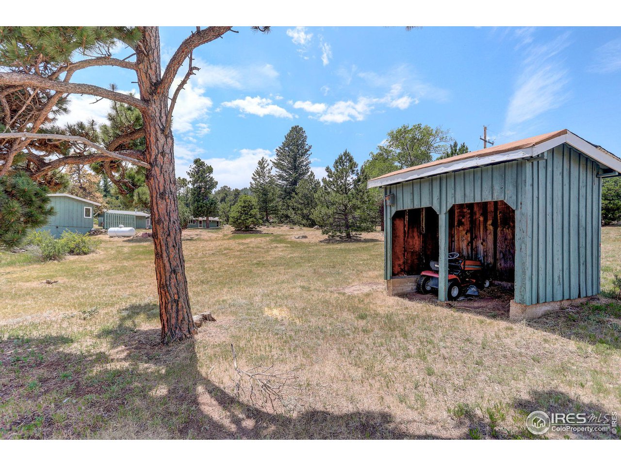 107 Deer Trail Road Boulder, CO 80302 - Photo 36 of 40 a view of a house with backyard and sitting area