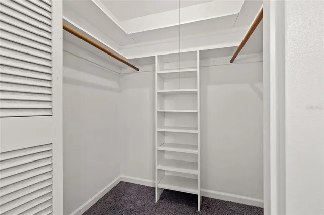 a bathroom with a sink a toilet and shower curtain