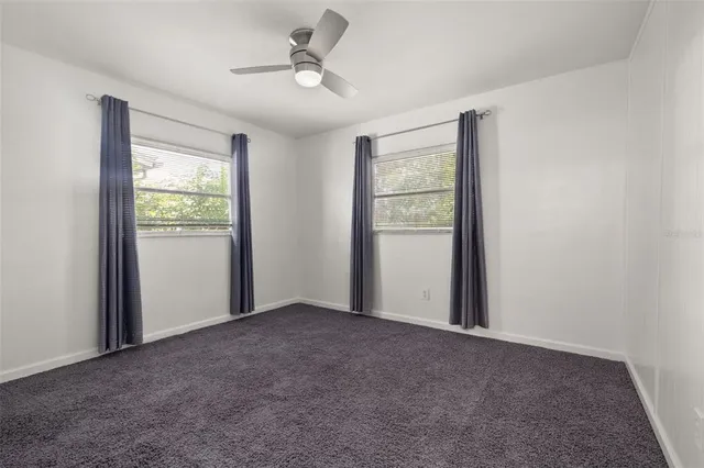 a view of an empty room with a balcony