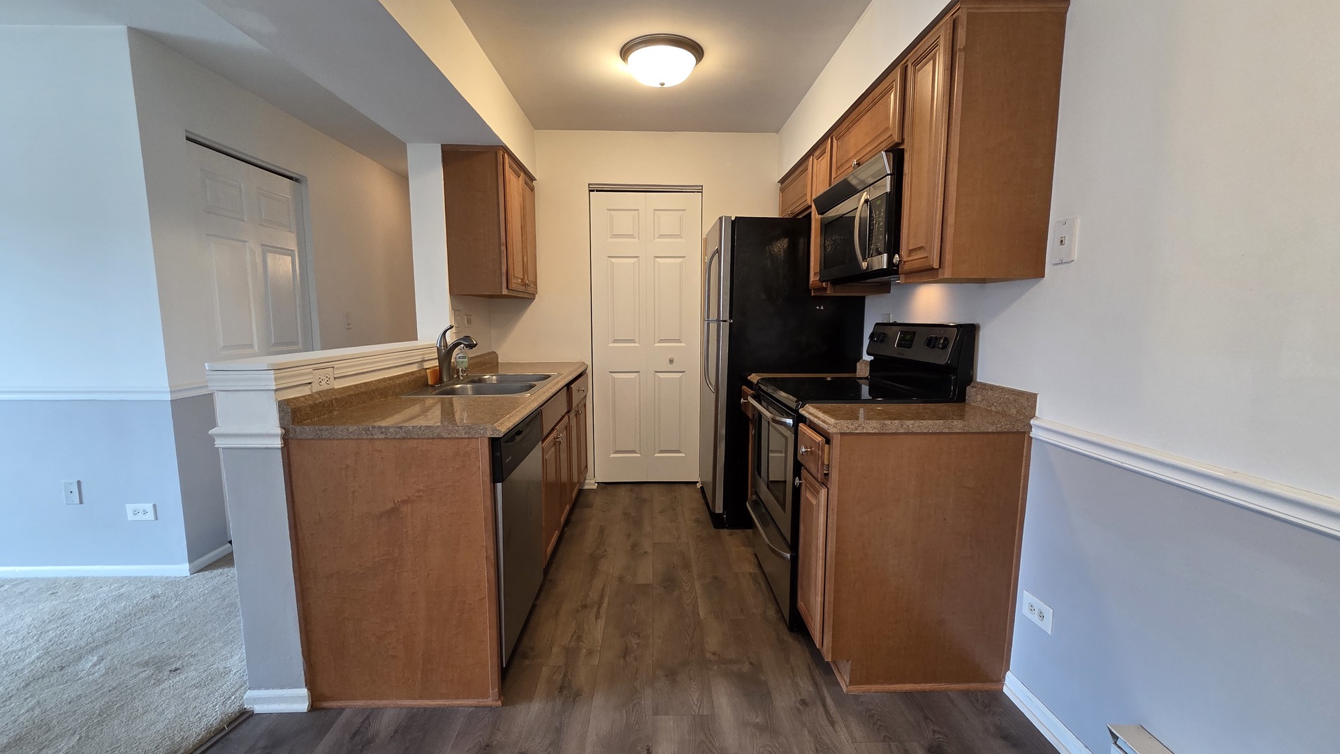 627 South Virginia Road, Unit 212 Crystal Lake, IL 60014 - Photo 4 of 15 a room with storage and utility