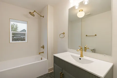 a bathroom with a sink and a bathtub