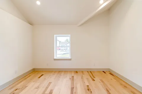 a view of an empty room and a window