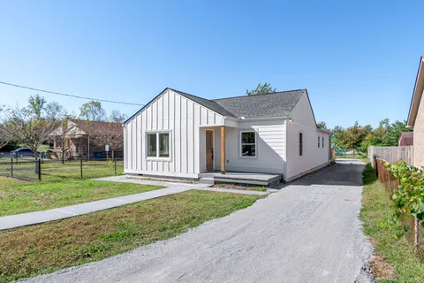 a view of a swimming pool with a yard