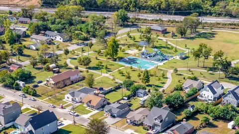 an aerial view of residential houses with outdoor space