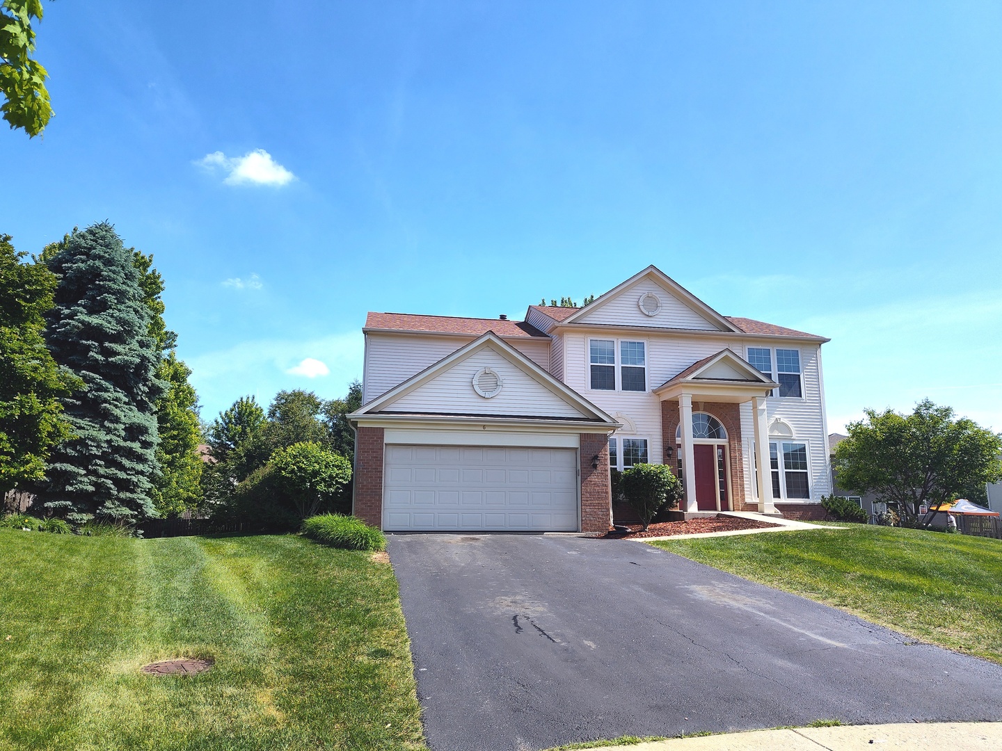 6 Forsythia Court Bolingbrook, IL 60490 - Photo 2 of 28 a front view of a house with a yard and garage