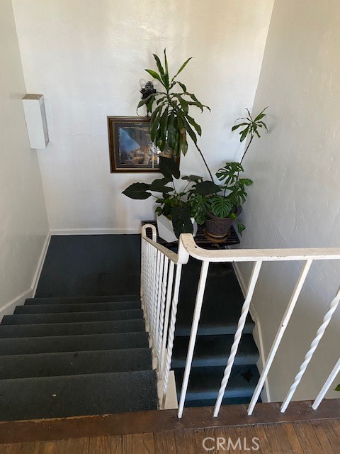 744 Walnut Avenue Long Beach, CA 90813 - Photo 13 of 41 a vase of flowers sitting on a table with wooden floor