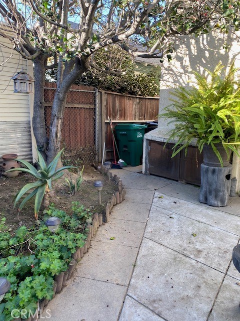 744 Walnut Avenue Long Beach, CA 90813 - Photo 17 of 41 a view of a house with a backyard and a tree
