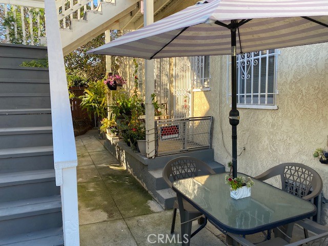 744 Walnut Avenue Long Beach, CA 90813 - Photo 18 of 41 a backyard of a house with table and chairs