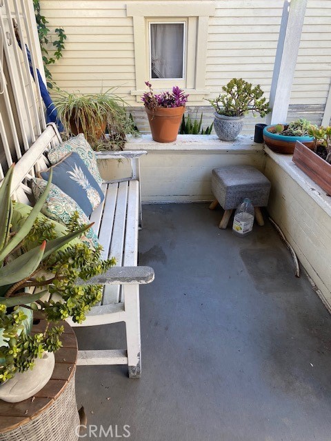 744 Walnut Avenue Long Beach, CA 90813 - Photo 20 of 41 a room with furniture and a potted plant