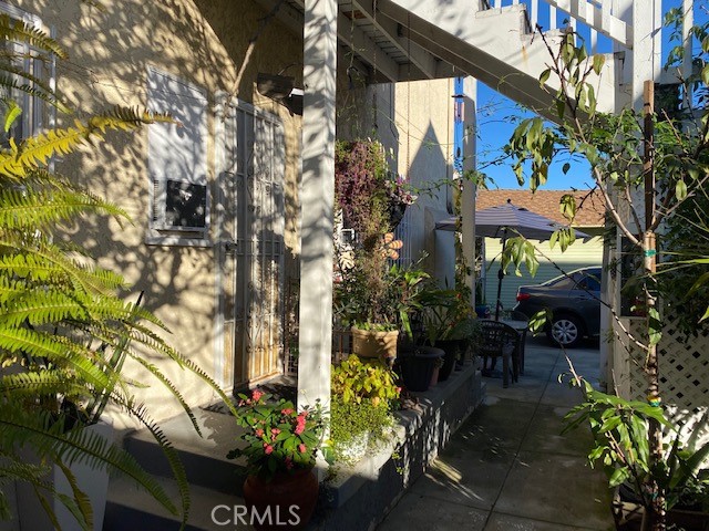 744 Walnut Avenue Long Beach, CA 90813 - Photo 22 of 41 a view of patio with table and chairs and potted plants