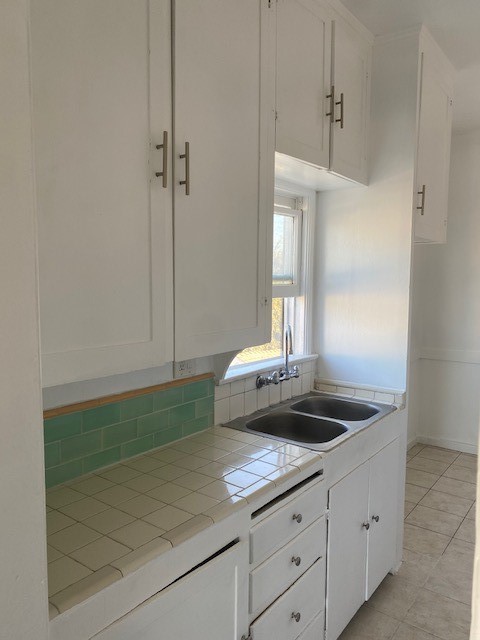 744 Walnut Avenue Long Beach, CA 90813 - Photo 28 of 41 a kitchen with a sink and cabinets