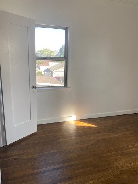 744 Walnut Avenue Long Beach, CA 90813 - Photo 38 of 41 a view of empty room with wooden floor and fan