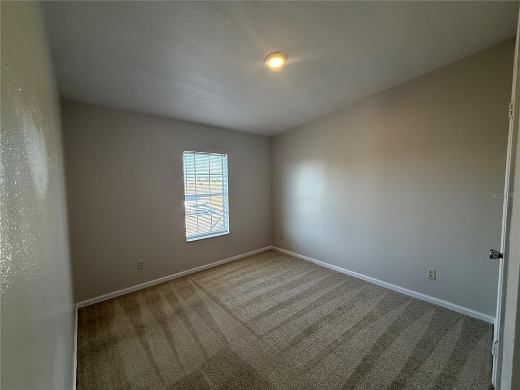 954 Brook Road North Fort Meade, FL 33841 - Photo 17 of 21 an empty room with a window