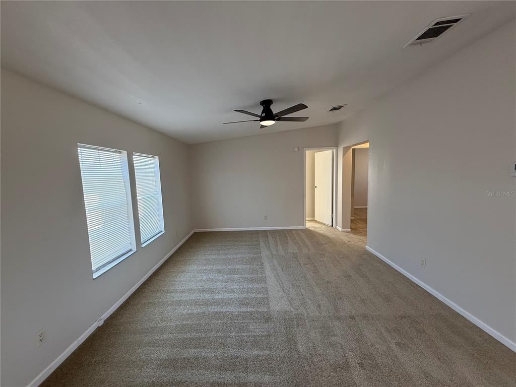 954 Brook Road North Fort Meade, FL 33841 - Photo 8 of 21 a view of a livingroom with a ceiling fan and window