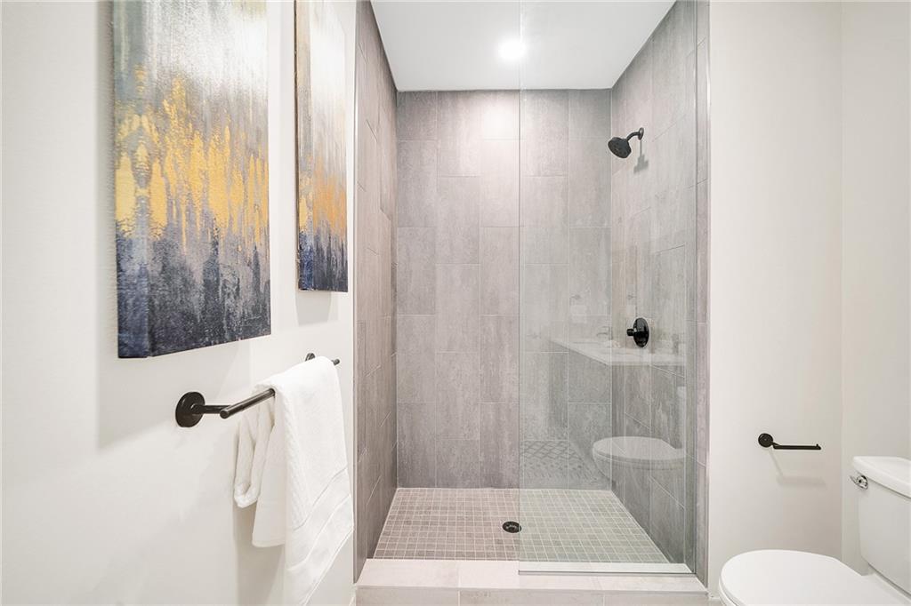 3725 Butler Street, Unit 406 Pittsburgh, PA 15201 - Photo 12 of 21 a bathroom with a toilet and a shower