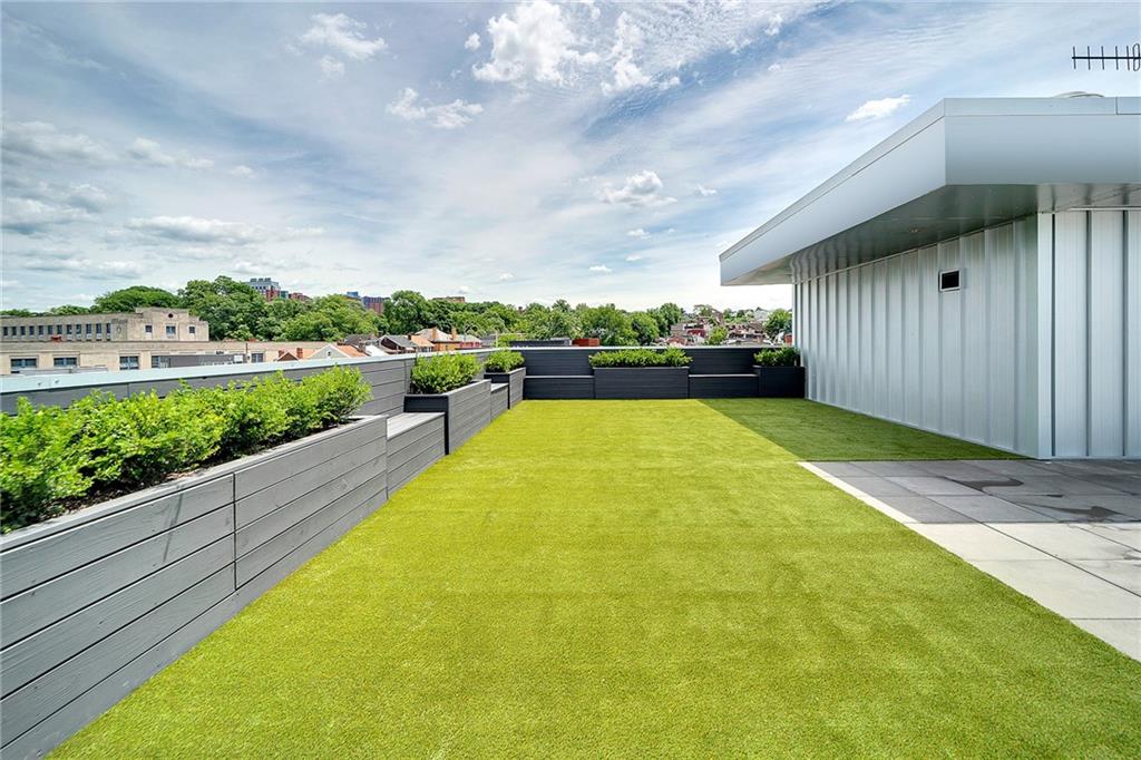 3725 Butler Street, Unit 406 Pittsburgh, PA 15201 - Photo 17 of 21 a view of a swimming pool and lounge chair