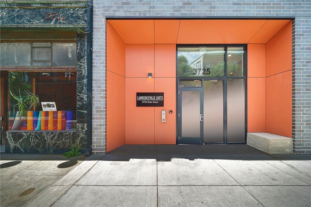 3725 Butler Street, Unit 406 Pittsburgh, PA 15201 - Photo 19 of 21 a front view of a house with a garage