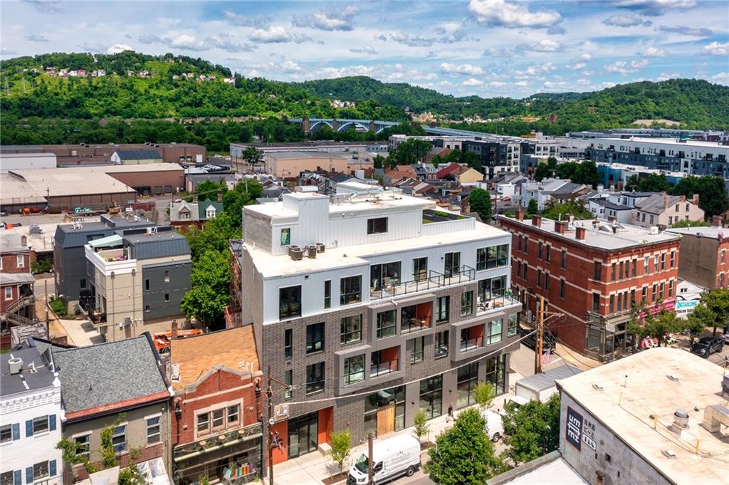 3725 Butler Street, Unit 406 Pittsburgh, PA 15201 - Photo 20 of 21 a large building with a clock tower in the middle