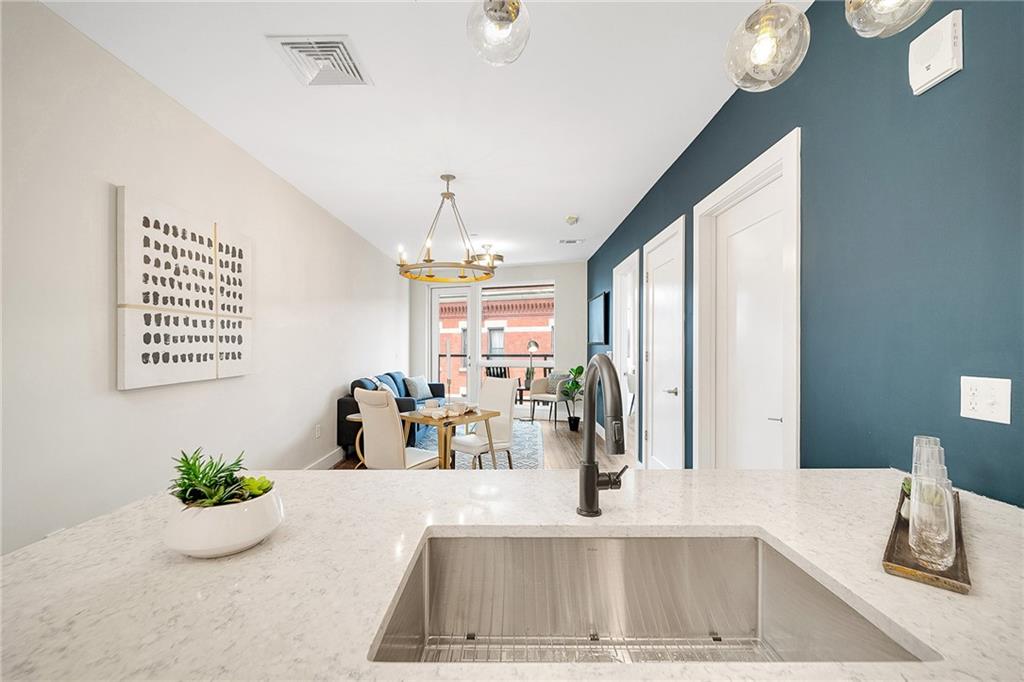 3725 Butler Street, Unit 406 Pittsburgh, PA 15201 - Photo 7 of 21 a view of a living room and window