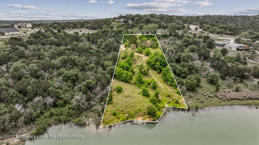 1165 Anchor Way Bluff Dale, TX 76433 - Photo 13 of 40 an aerial view of a houses with a yard