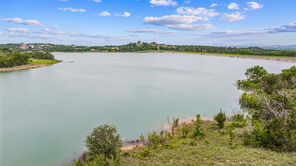 1165 Anchor Way Bluff Dale, TX 76433 - Photo 18 of 40 a view of a lake with a city