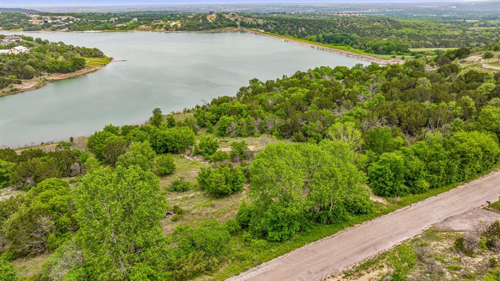 1165 Anchor Way Bluff Dale, TX 76433 - Photo 22 of 40 a view of a lake with a city view