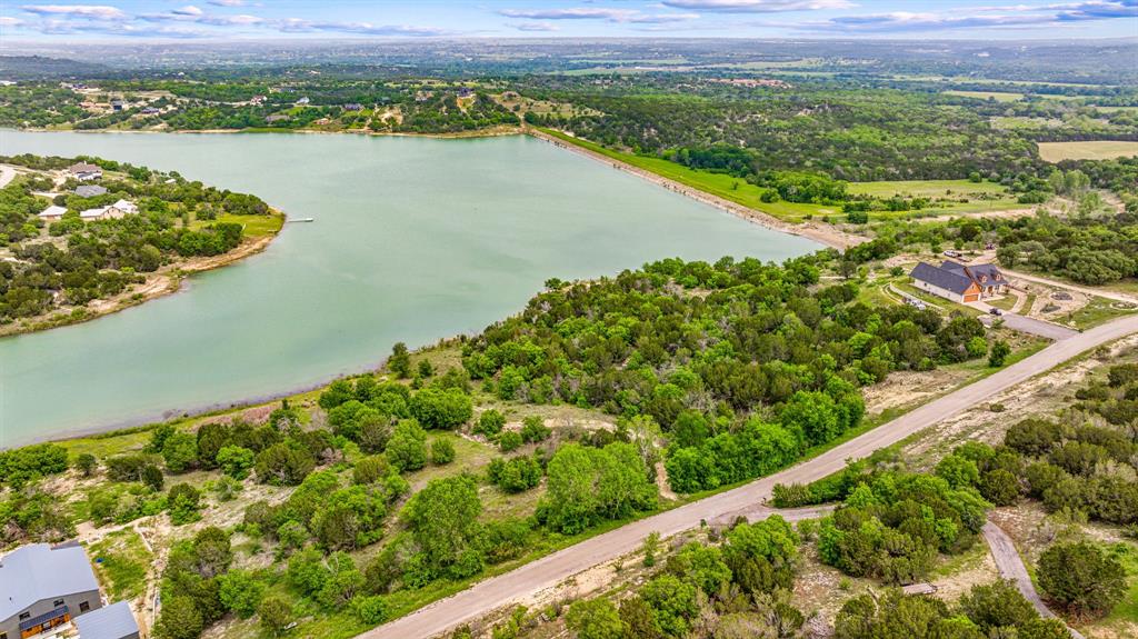 1165 Anchor Way Bluff Dale, TX 76433 - Photo 24 of 40 a view of a lake with a city view