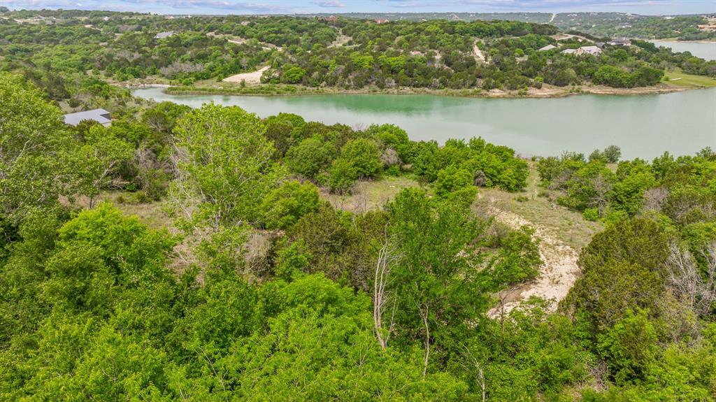 1165 Anchor Way Bluff Dale, TX 76433 - Photo 27 of 40 an aerial view of residential houses with outdoor space and lake view