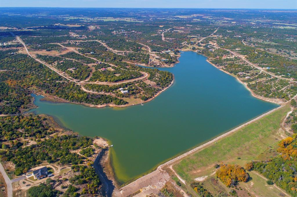 1165 Anchor Way Bluff Dale, TX 76433 - Photo 35 of 40 an aerial view of a house with a lake view