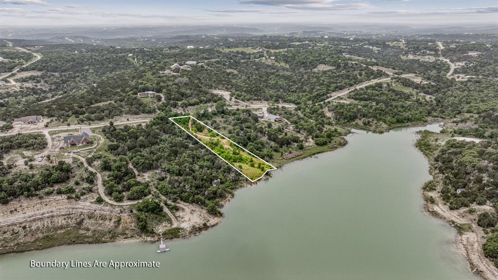 1165 Anchor Way Bluff Dale, TX 76433 - Photo 5 of 40 a view of a lake with a city