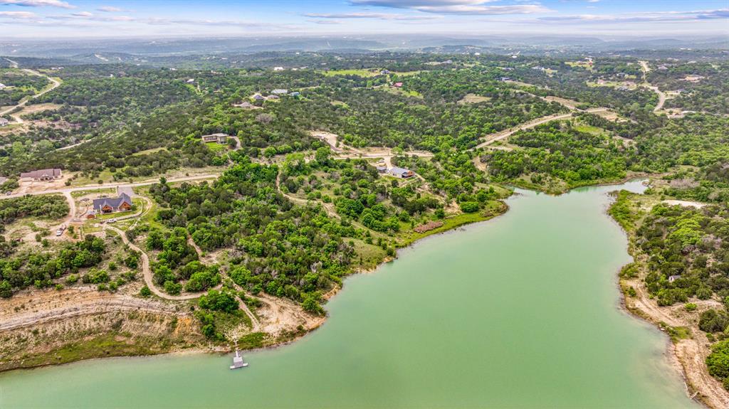 1165 Anchor Way Bluff Dale, TX 76433 - Photo 6 of 40 a view of a lake with a city