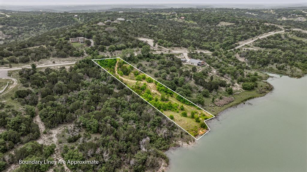 1165 Anchor Way Bluff Dale, TX 76433 - Photo 7 of 40 an aerial view of residential houses with outdoor space and trees