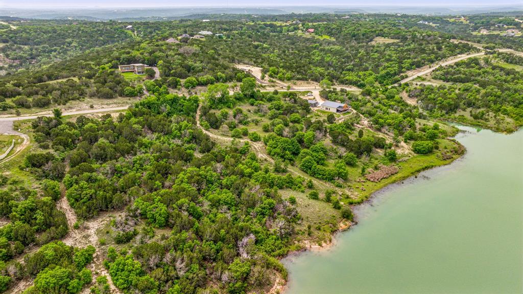 1165 Anchor Way Bluff Dale, TX 76433 - Photo 8 of 40 an aerial view of residential houses with outdoor space and trees