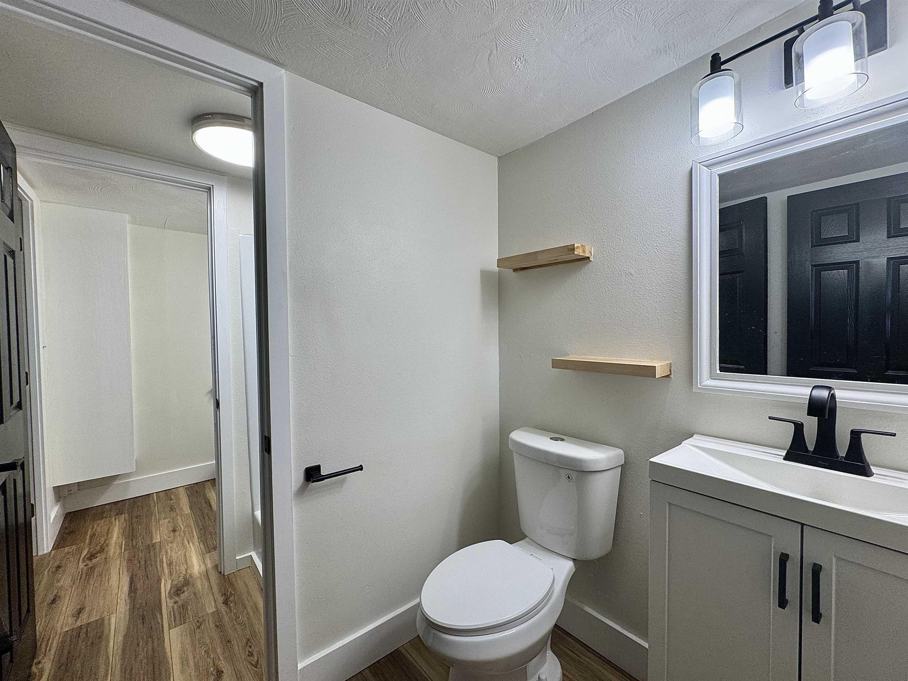 111 Kahului Beach Road, Unit D321 Kahului, HI 96732 - Photo 14 of 22 a bathroom with a toilet a sink and mirror
