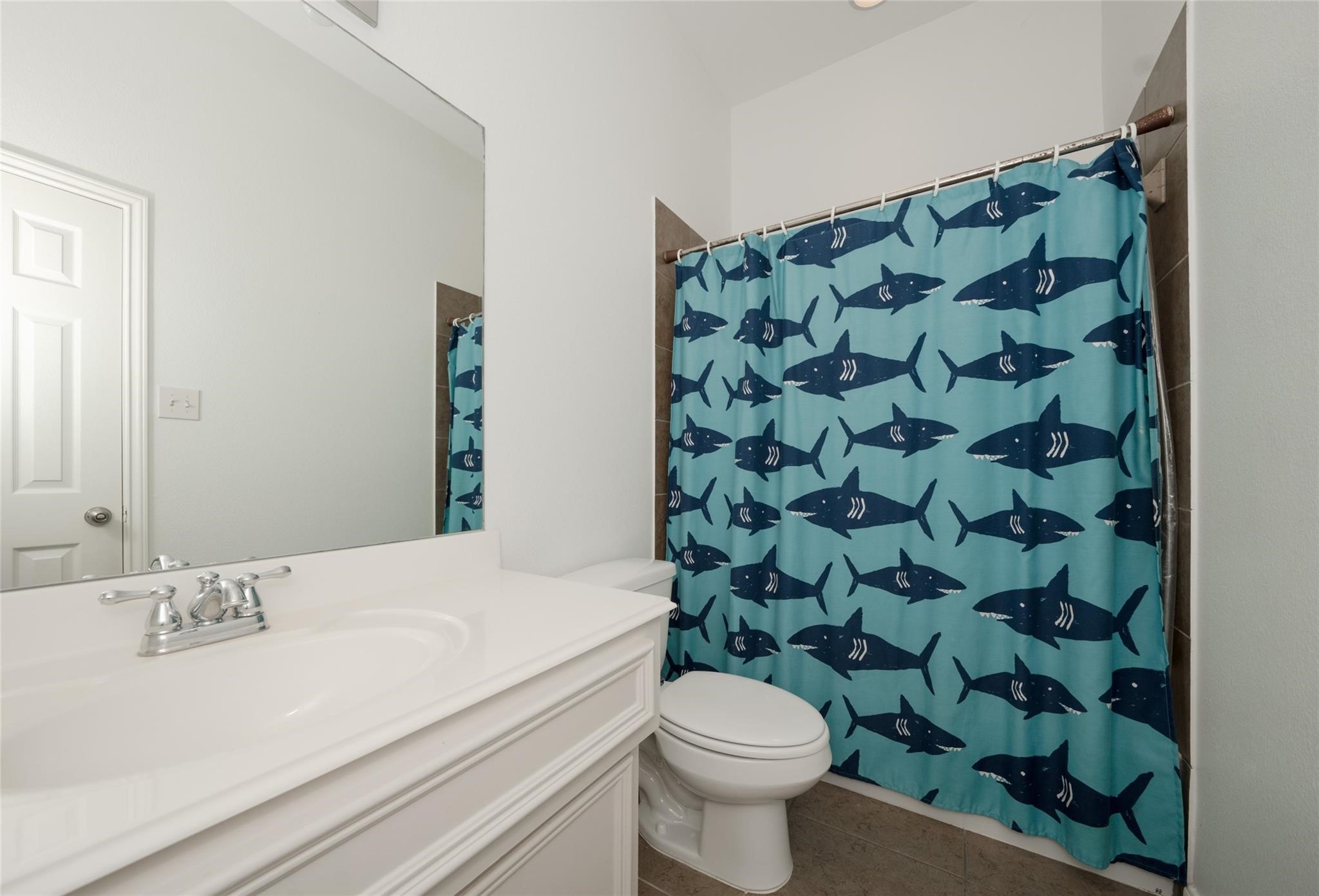 14830 Barton Grove Lane Humble, TX 77396 - Photo 25 of 36 a bathroom with a sink and a mirror